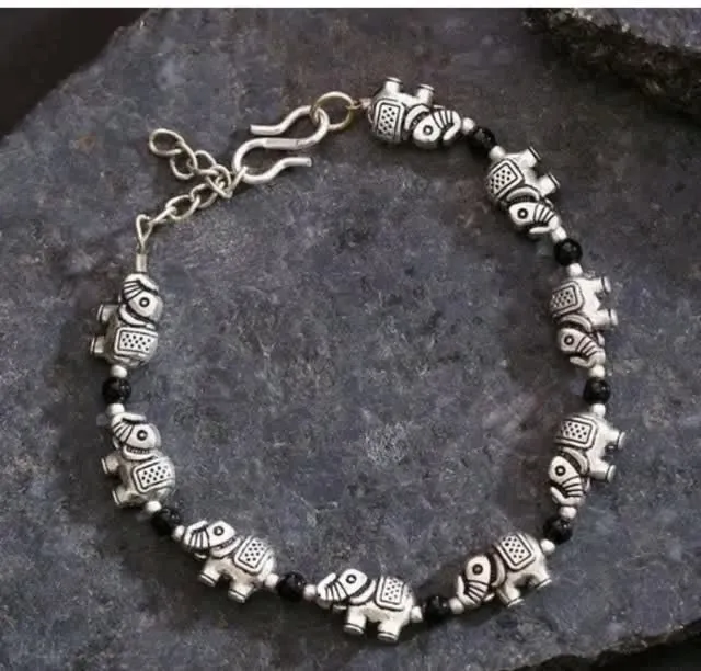 Oxidised elephant charm bracelet on slate